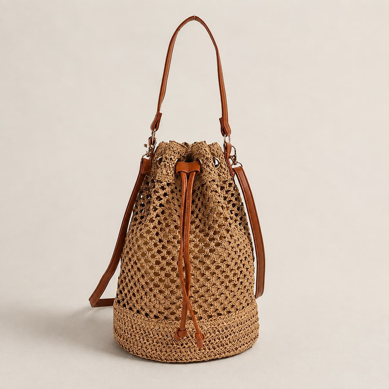 Straw handbag with brown leather trim