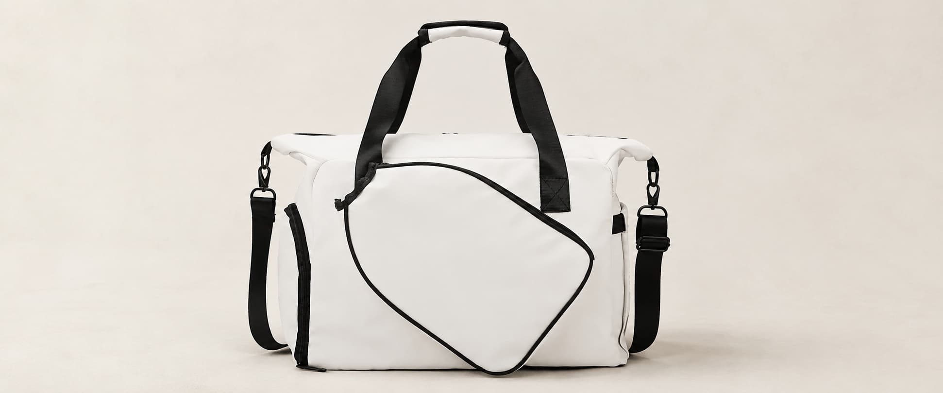 White travel bag with black straps
