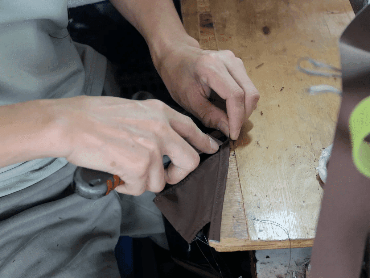 Hands refining a bag sample during original development